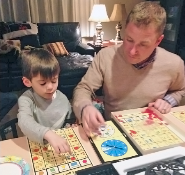 Dad and Son Playing a Favorite Board Game - I Got It!